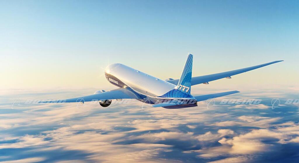 Boeing Images - Boeing 777 In-Flight over Clouds Tail View